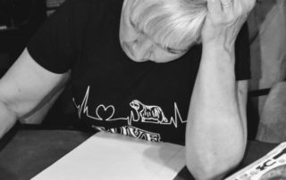 Woman Looks at Notepad